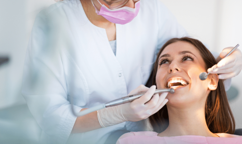 Dentist examining patient's teeth during dental treatment in Corpus Christi.