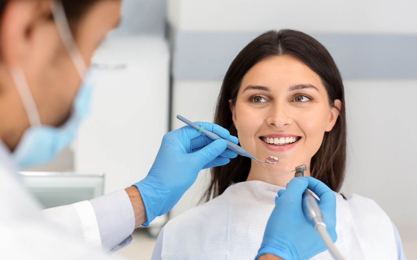 Happy patient smiling during dental examination with dentist in Corpus Christi.