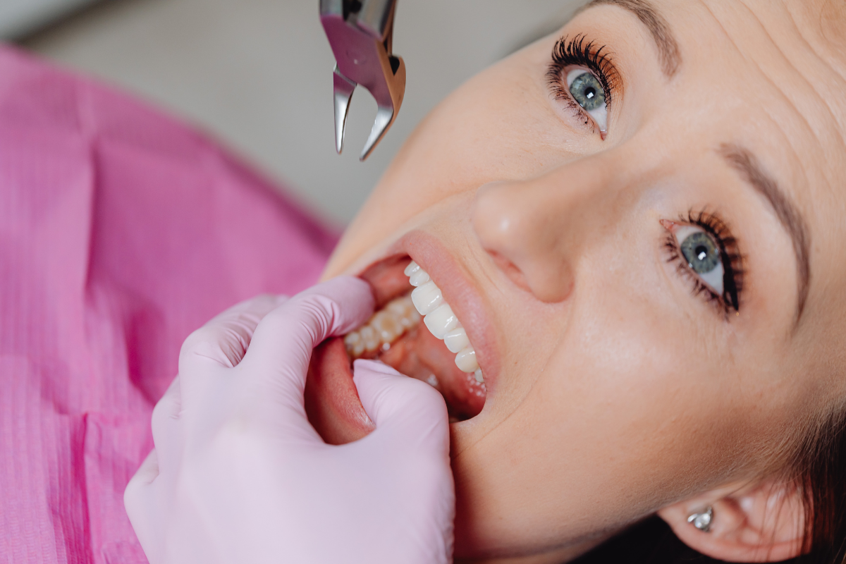 Patient displaying ideal tooth proportions and symmetry during cosmetic smile design consultation.